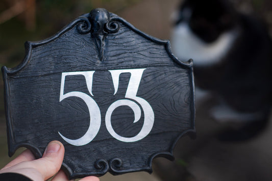 gothic house number sign